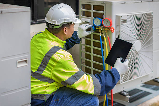 Professional Heat Pump Repair technician working in Pell City, AL